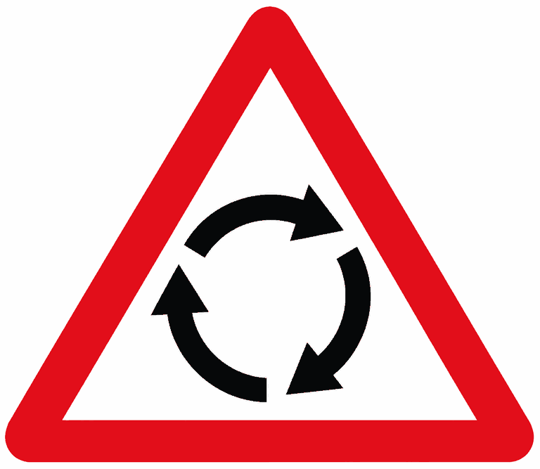 Red-bordered warning triangle containing three curved black arrows in a ring: a roundabout ahead.