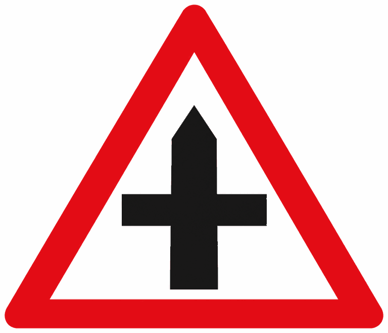 Red-bordered warning triangle containing a black cross: a crossroads ahead.
