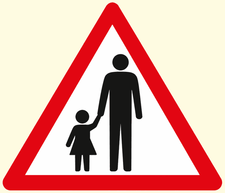 Red-bordered warning triangle showing an adult and a child walking hand in hand: people may be walking in the road.